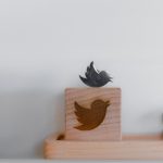 brown wooden bird house on brown wooden box
